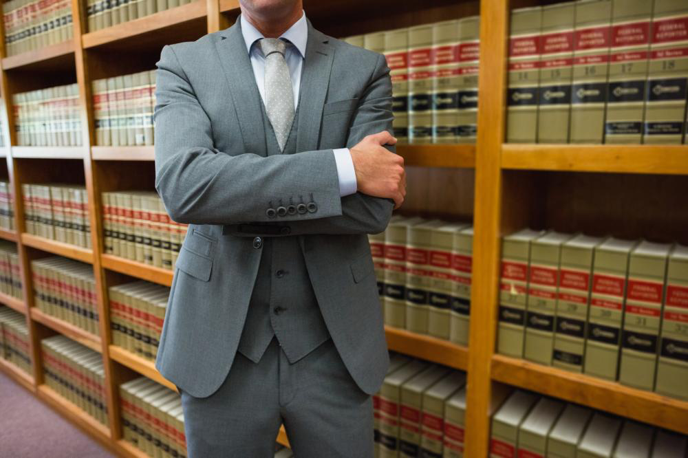 a lawyer standing in the law library at the university