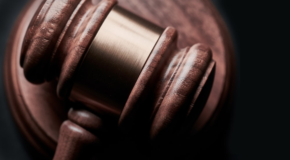 a shot of a gavel depicting courtroom deliberations