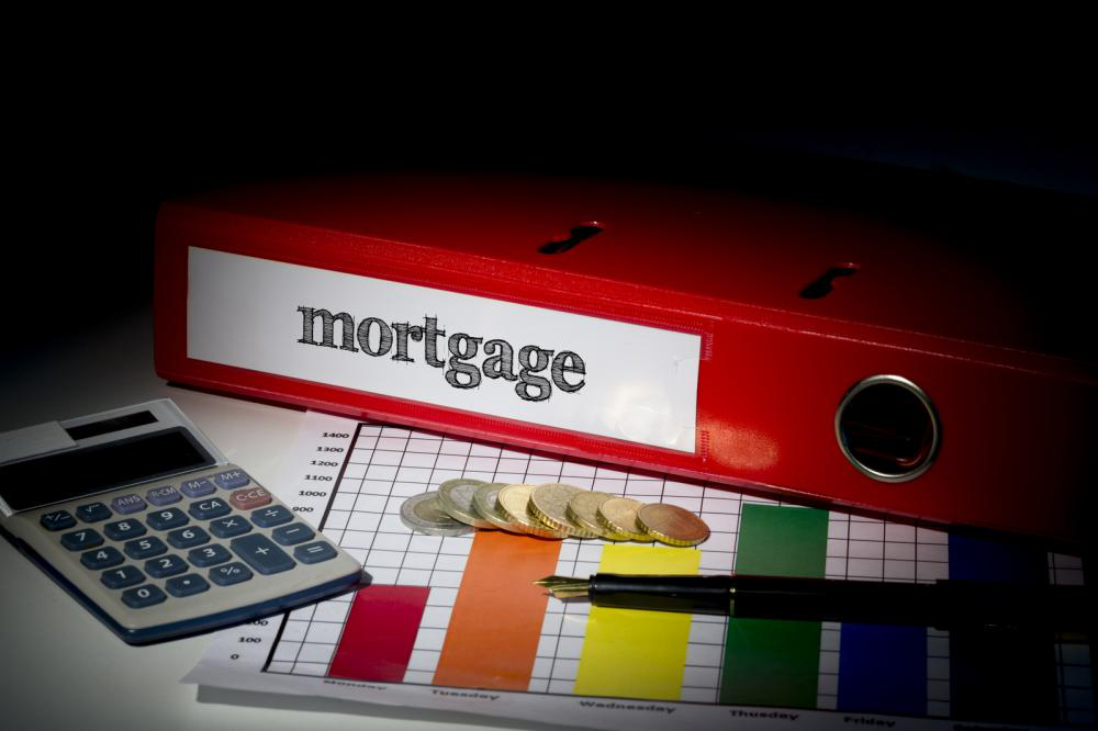 Calculating mortgage with a calculator and necessary paperwork