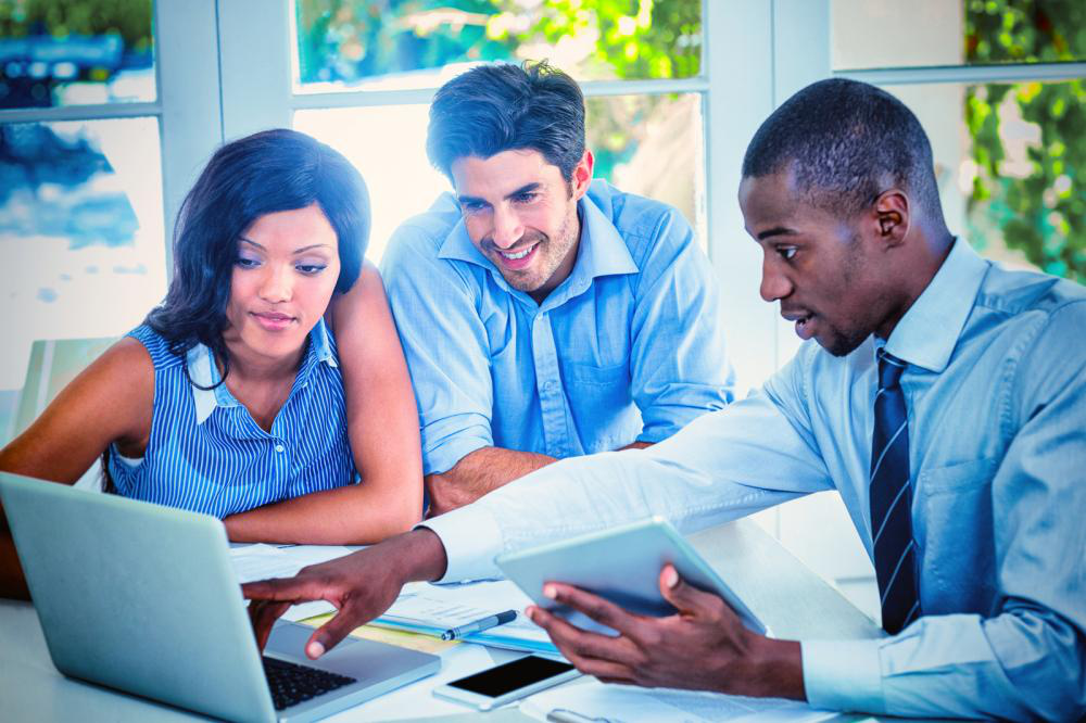 A couple discussing their mortgage refinancing with a real estate attorney