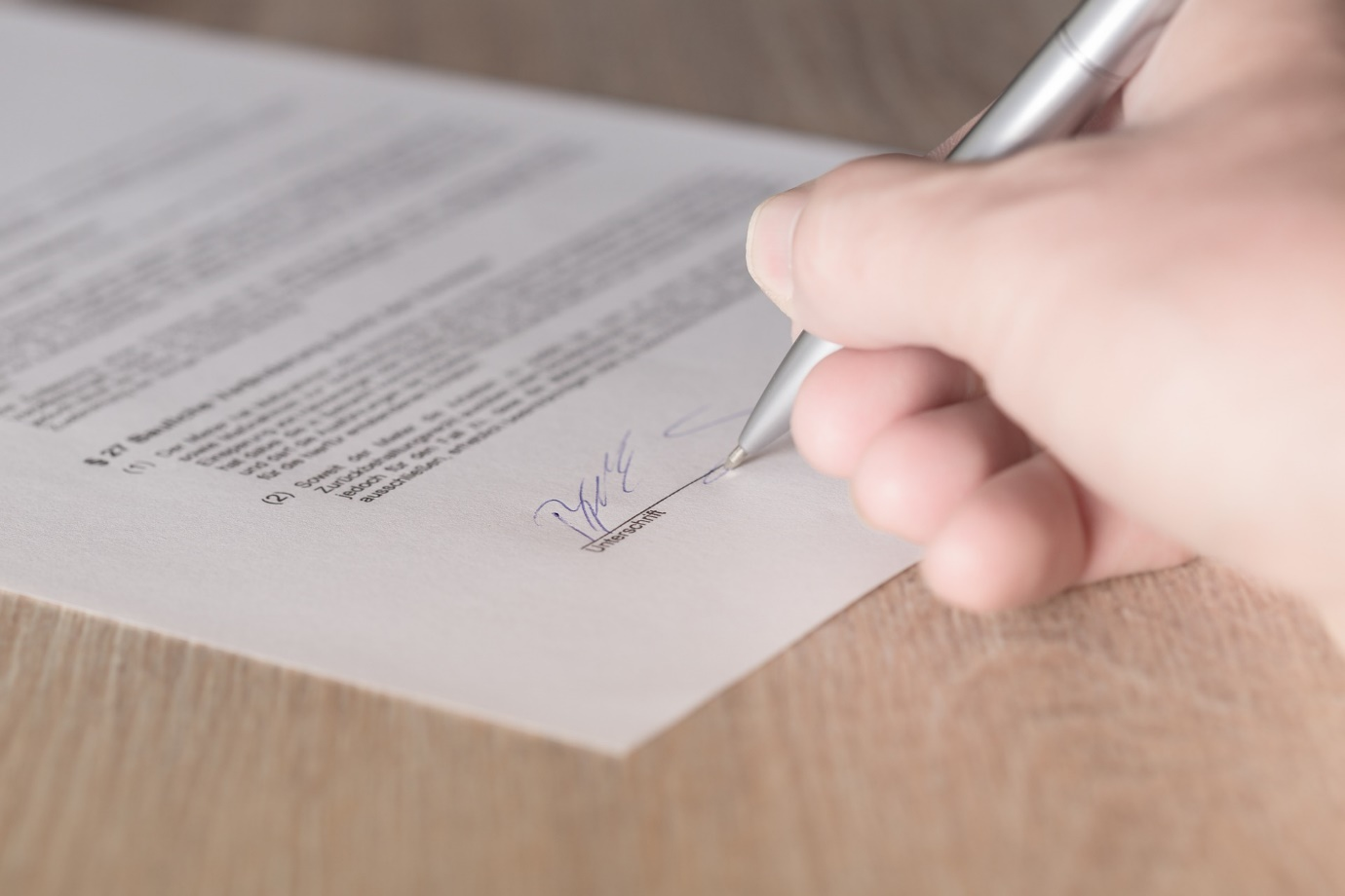 A person signing a contract