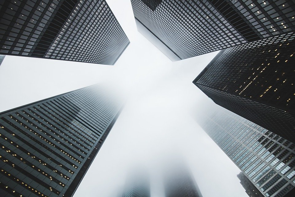 High rise buildings disappearing into the clouds